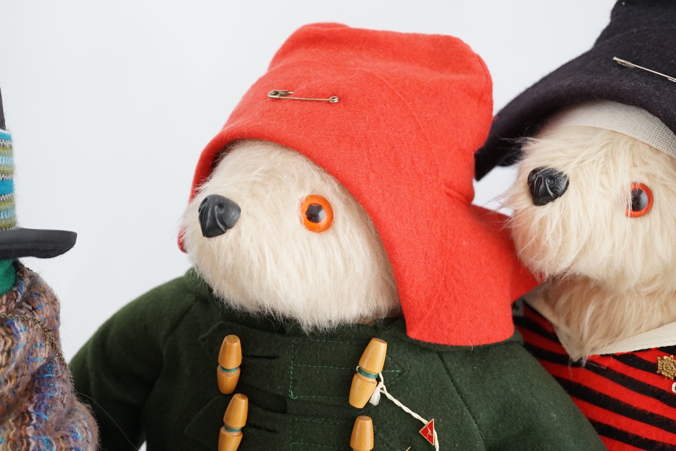 Aunt Lucy with glasses and label, in good condition, two Paddington bears, one with green jacket, Dunlop boots, in excellent condition, one in football outfit